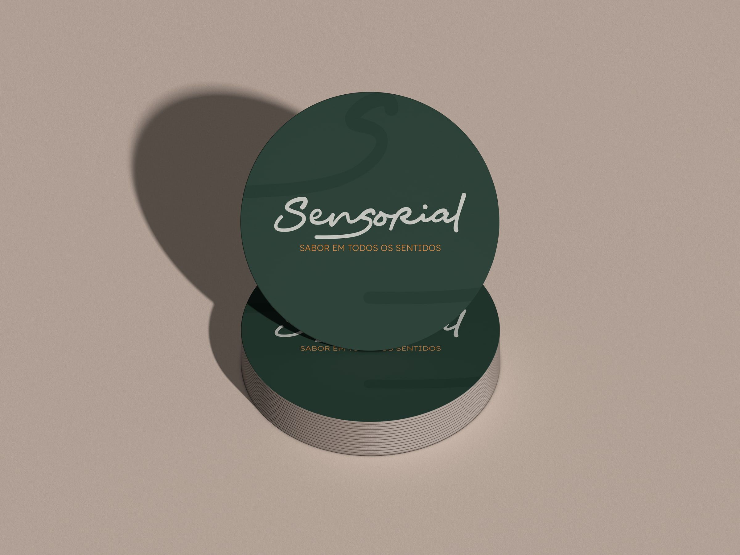 Bottle-green coasters with the logo.