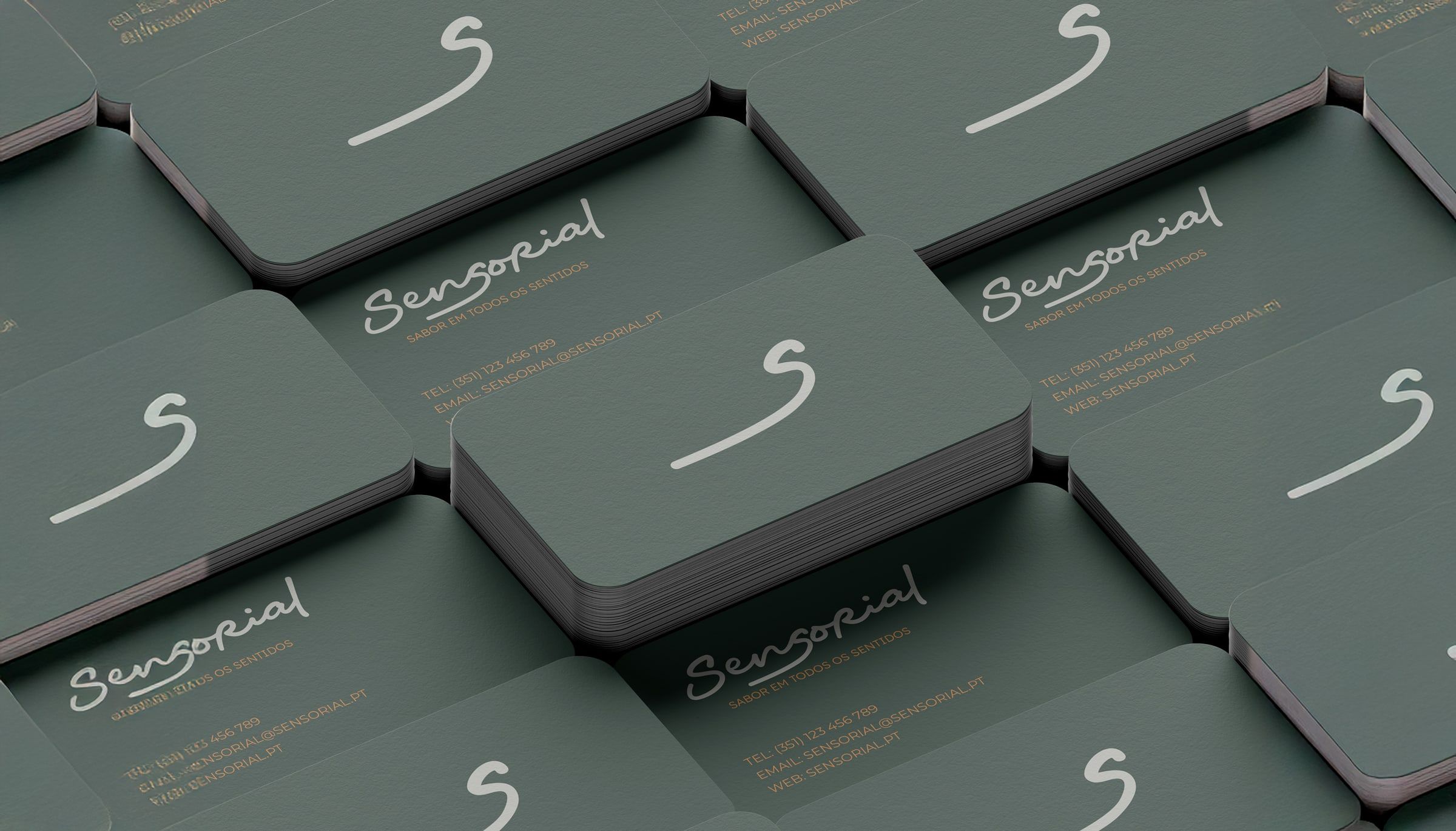 Business cards in bottle green and copper.