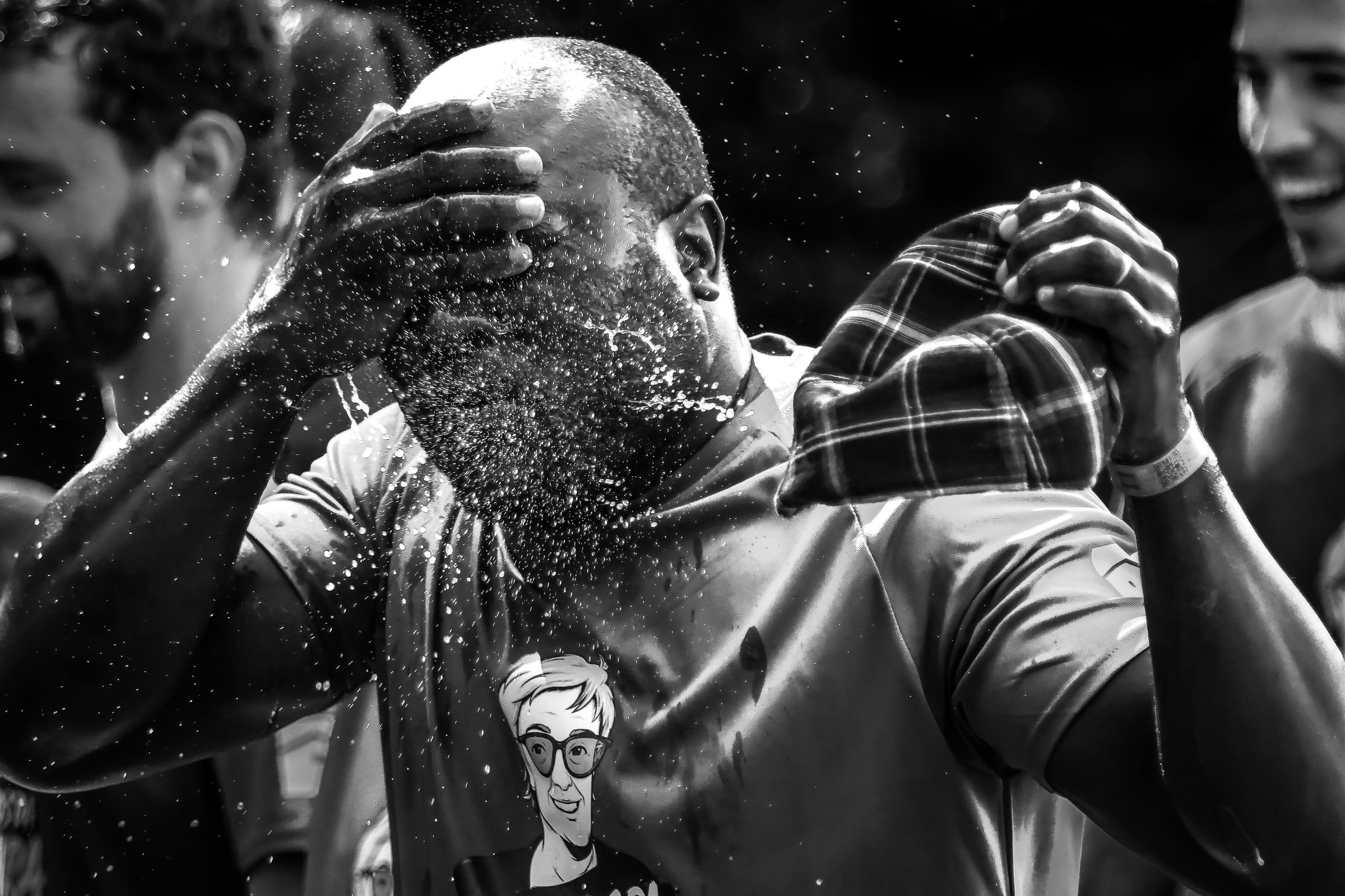 A participant washing their face after the race