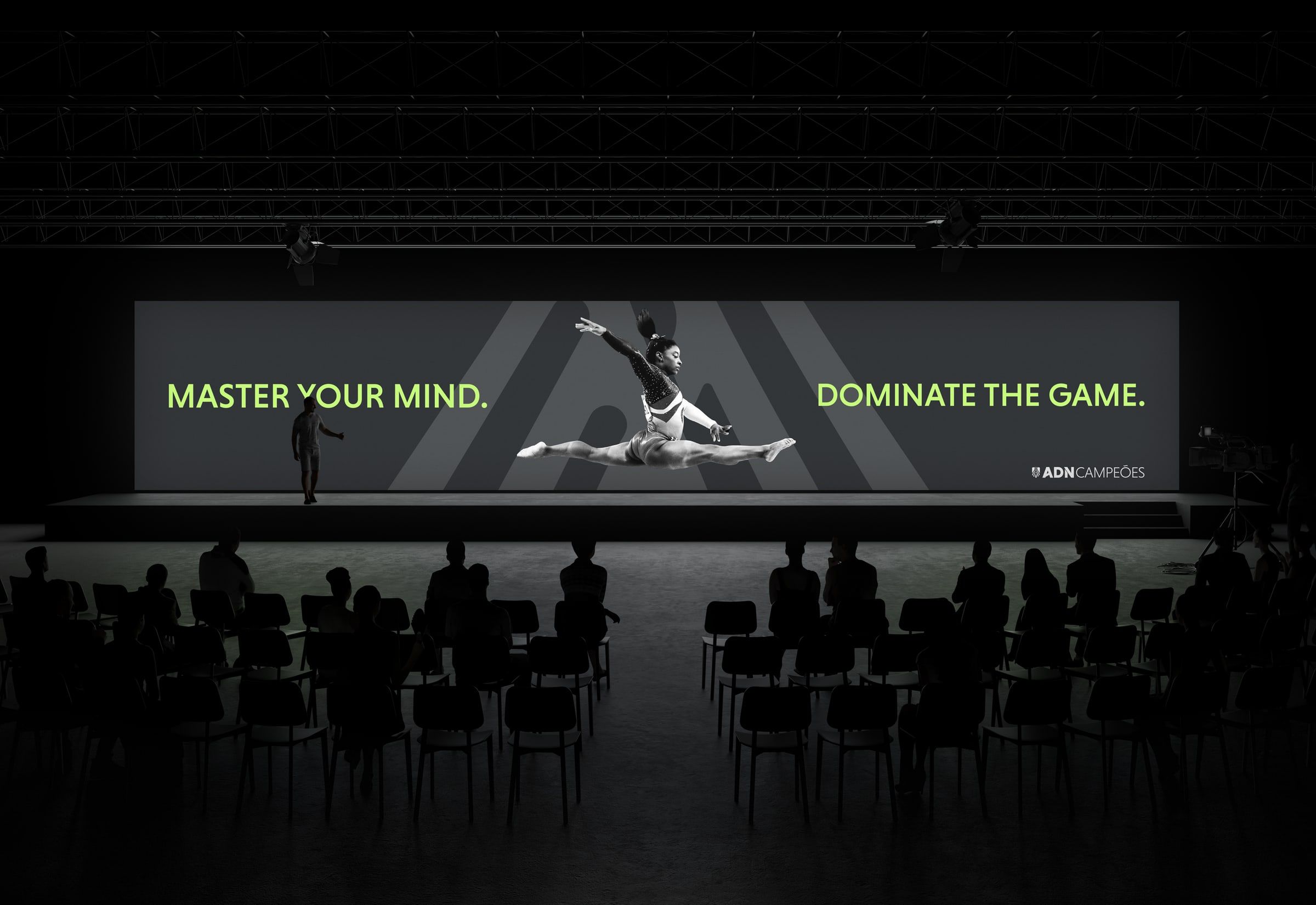 Auditorium screen reading “Master your mind. Dominate the game.”