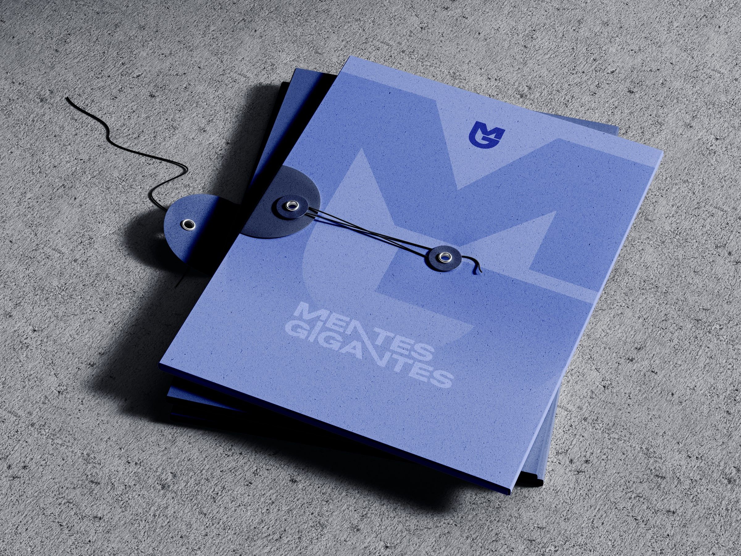 Purple folders with the MG monogram.