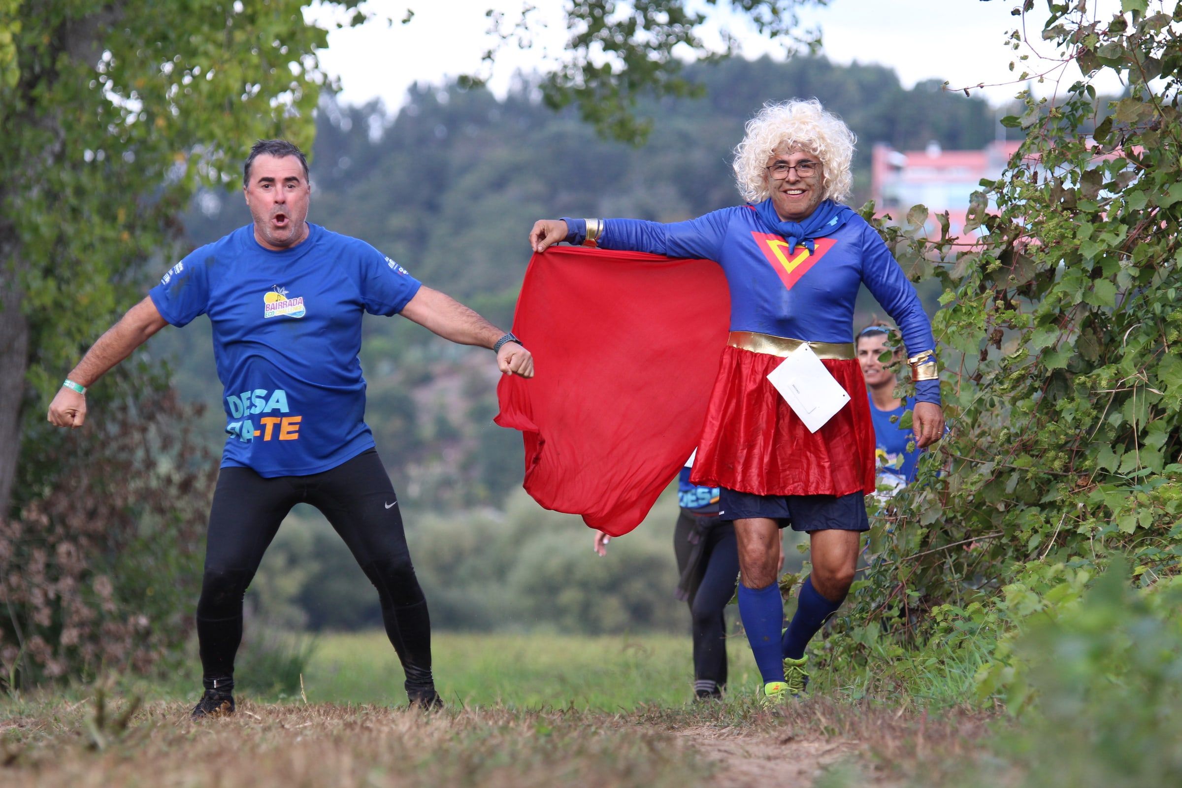Two costumed participants playing at bullfighting on the course.